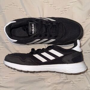 Adidas Women’s Black Sneakers with White Stripes